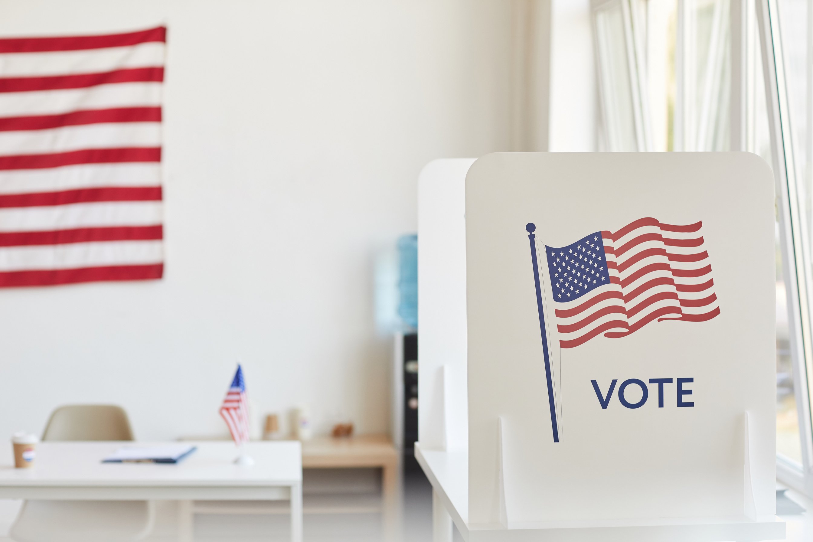 Empty Voting Booth with American Flag